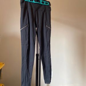Athleta leggings with zipper detail. Size medium